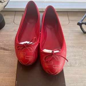 Red Gucci flats.